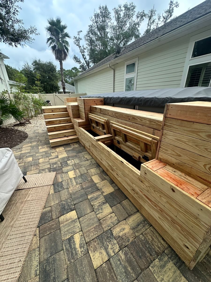 Pressure-treated pine swim spa deck with built-in steps and storage on a paver patio, Julington Creek FL