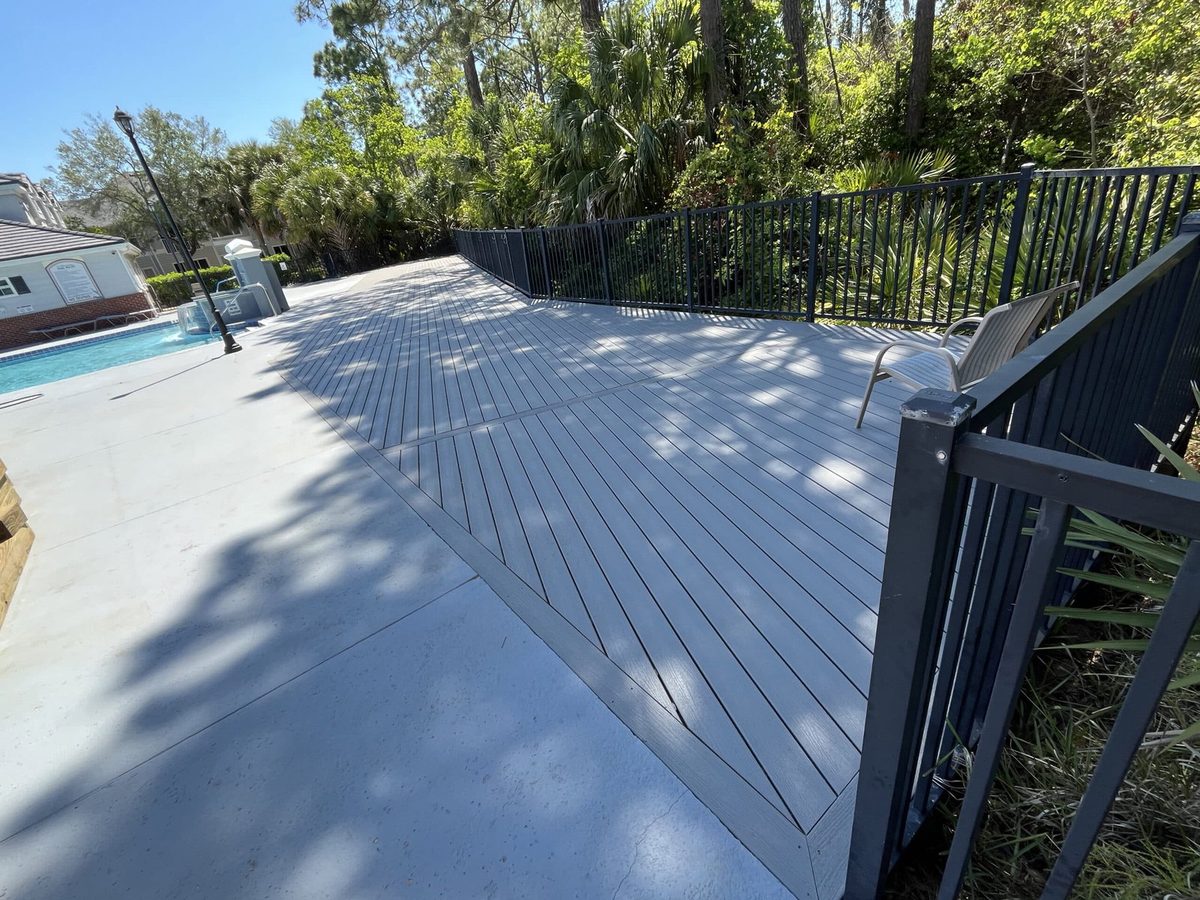 Gray composite deck boards with a hidden-fastener finish, built near Jacksonville, FL