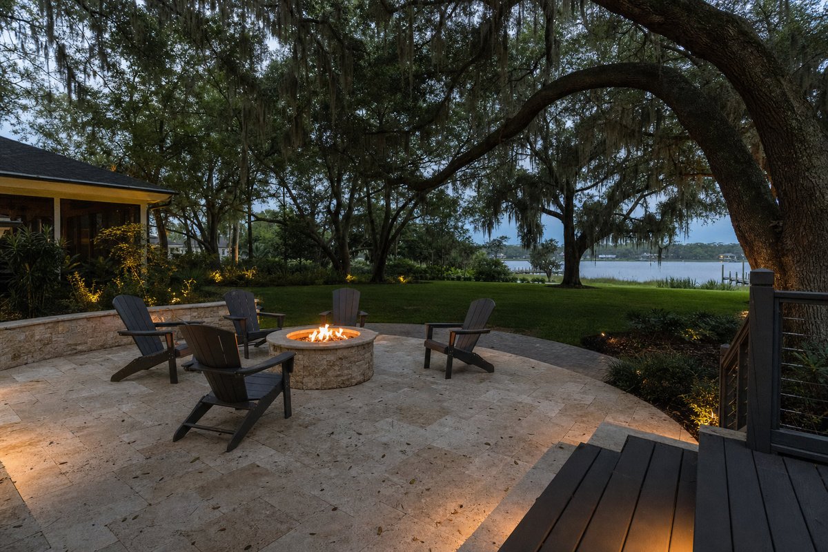Travertine Ivory paver patio in Mandarin Jacksonville at golden hour with firepit and live oaks